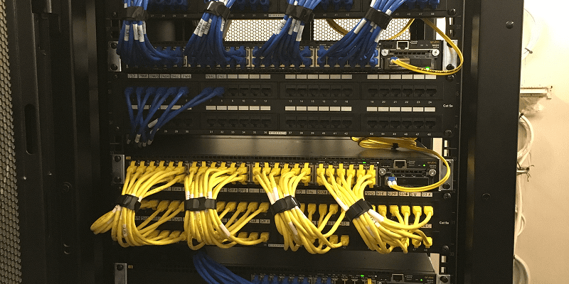 Blue and yellow cables in server rack