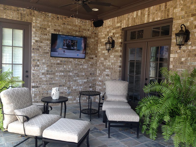 Outdoor seating area with ferns