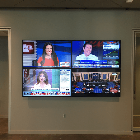 Four news broadcasts on large monitor